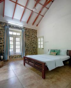 Ένα ή περισσότερα κρεβάτια σε δωμάτιο στο Lilac Haven Villa