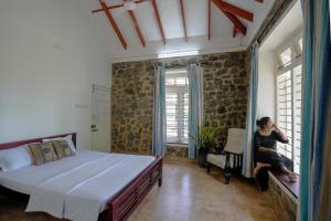 Ένα ή περισσότερα κρεβάτια σε δωμάτιο στο Lilac Haven Villa