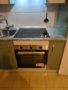 Η κουζίνα ή μικρή κουζίνα στο Acogedor Apartamento