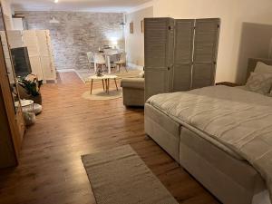 Ένα ή περισσότερα κρεβάτια σε δωμάτιο στο Kleine Auszeit - Urlaub auf dem Bauernhof