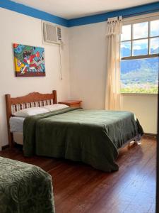 Ένα ή περισσότερα κρεβάτια σε δωμάτιο στο HOTEL MONTANAS