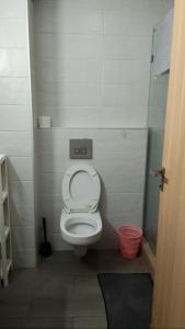 a small bathroom with a toilet in a stall at Apartment kamal park in Mohammedia +4 photos