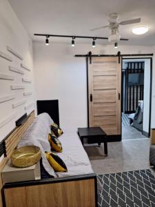 a bedroom with a bed with pillows on it at Mieszkanie 3 pokoje-Faktura in Szczecinek +7 photos