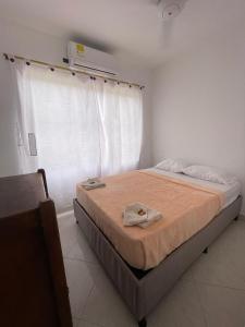 a bedroom with a bed in a room at Hotel Casa Colonial Moñitos in Moñitos