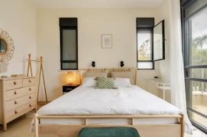 En eller flere senge i et værelse på Mountain Garden Villa