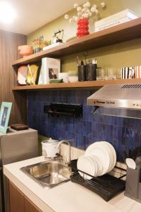 Φωτογραφία από το άλμπουμ του House of Keul - 2BR cozy condo in Dumaguete with pool and free laundry for long term guests up to 4 pax σε Piapi