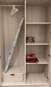 a walk in closet with a staircase in it at شقة استديو- السليمانية in Riyadh +1 photo