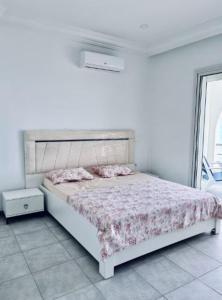 Ένα ή περισσότερα κρεβάτια σε δωμάτιο στο Studio proximité de plage guyville