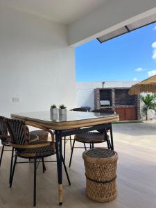a dining room with a table and chairs at Mary's Villas Private Pool In Noord in Noord