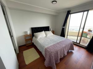Ένα ή περισσότερα κρεβάτια σε δωμάτιο στο Valparaiso Preciosa Vista al Mar +19 φωτογραφίες
