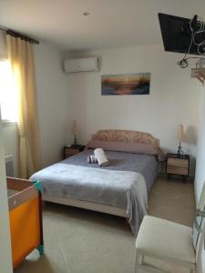 En eller flere senge i et værelse på Appartement Amaryllis