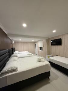 Ένα ή περισσότερα κρεβάτια σε δωμάτιο στο Ivootel