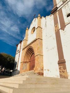 a building with a gate and stairs in front of it at Casa da Se Cottage in Silves +3 photos