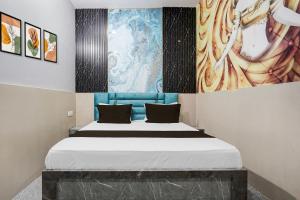 Ένα ή περισσότερα κρεβάτια σε δωμάτιο στο Hotel O Grand Hotel