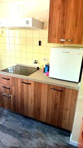 Η κουζίνα ή μικρή κουζίνα στο Luminoso e centralissimo attico, splendida vista panoramica sulle Dolomiti e sulle piste olimpiche