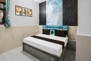 Ένα ή περισσότερα κρεβάτια σε δωμάτιο στο Hotel O Grand Hotel