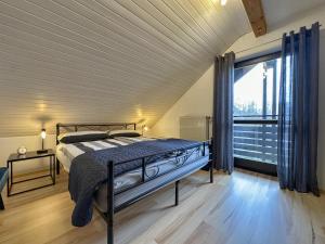 Ένα ή περισσότερα κρεβάτια σε δωμάτιο στο Böhmerwaldnest