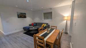 a living room with a table and a couch at A&A Resident in North Vancouver