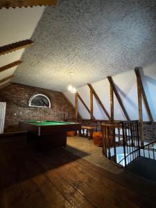 a room with a ping pong table in a building at Vintage Villa Mitskheta in Mtskheta