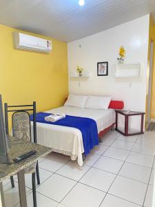 Ένα ή περισσότερα κρεβάτια σε δωμάτιο στο Bru&Mar Pousada