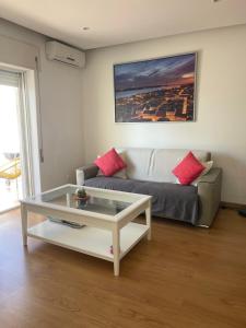a living room with a couch and a coffee table at La Seixalia, charme e grande terraço in Seixal +63 photos