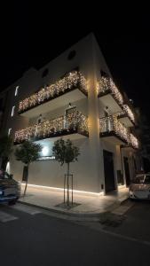 a building with christmas lights on it at night at Dimore D'Elite & Spa in Monopoli