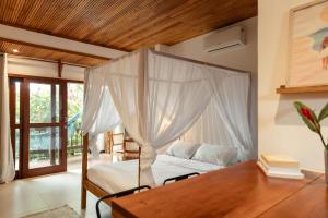 Postel nebo postele na pokoji v ubytování Villa Estrela Bungalow