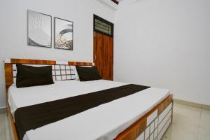 Voodi või voodid majutusasutuse Hotel O by OYO The Brothers Hotel Inn toas