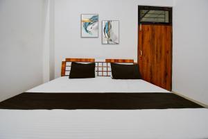 Voodi või voodid majutusasutuse Hotel O by OYO The Brothers Hotel Inn toas