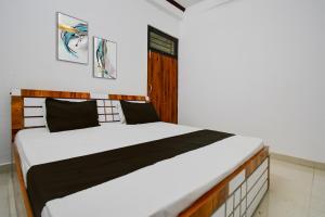 Voodi või voodid majutusasutuse Hotel O by OYO The Brothers Hotel Inn toas