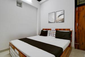 Voodi või voodid majutusasutuse Hotel O by OYO The Brothers Hotel Inn toas