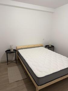 Una cama o camas en una habitación de Comme chez soi