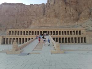 a group of people walking down the steps of a building at Luxor Nile palace in Luxor