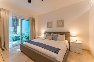 Ένα ή περισσότερα κρεβάτια σε δωμάτιο στο Papaya 15 Apartments +156 φωτογραφίες