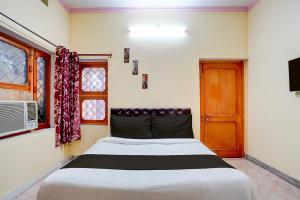 Ένα ή περισσότερα κρεβάτια σε δωμάτιο στο Hotel O HEAVEN HOME STAY +21 φωτογραφίες