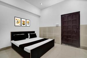 Ένα ή περισσότερα κρεβάτια σε δωμάτιο στο Hotel O Dream Guest House