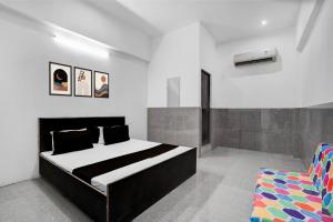 Ένα ή περισσότερα κρεβάτια σε δωμάτιο στο Hotel O Dream Guest House