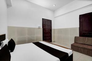 Ένα ή περισσότερα κρεβάτια σε δωμάτιο στο Hotel O Dream Guest House