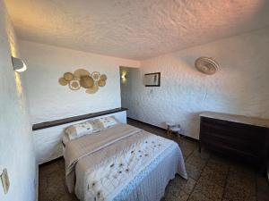 Giường trong phòng chung tại Casa Bela Vista Ilha de Jaguanum