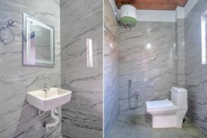 Ένα μπάνιο στο Hotel O Happy Homes Resort