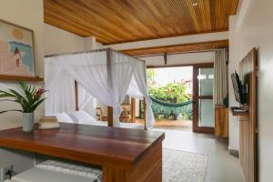 TV a/nebo společenská místnost v ubytování Villa Estrela Bungalow