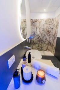 a bathroom with a sink and a bath tub at Dimora Fortunato in Bernalda +27 photos