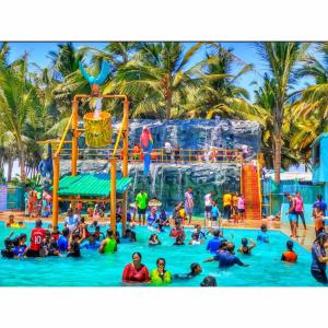 a group of people in the water at a water park at Dreamworld Waterpark Resort Virar in Virār
