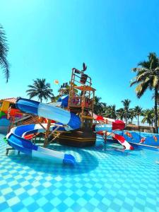 a water park with a water slide in a pool at Dreamworld Waterpark Resort Virar in Virār