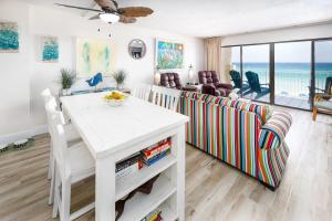 a living room with a couch and a table at Gulf Side 402 Pet friendly gulf front condo in Fort Walton Beach