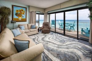 a living room with a couch and a view of the ocean at Gulf Side 601 Pet friendly gulf front condo in Fort Walton Beach