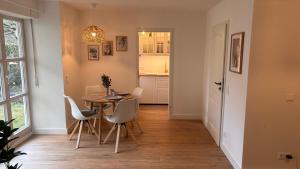 a dining room with a table and chairs at Fewo Eirich in Günzburg