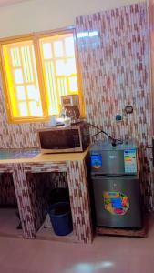 Kuchyň nebo kuchyňský kout v ubytování kanoukagni Ouagadougou BF + 6 fotografií