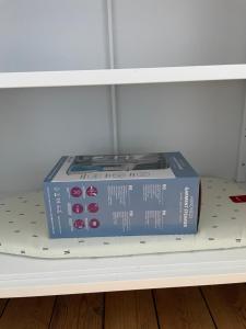 a blue box sitting on top of a shelf at Maison de pêcheur proche du bourg in Ile aux Moines
