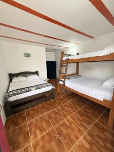 Postel nebo postele na pokoji v ubytování Mirador Verde By Nala